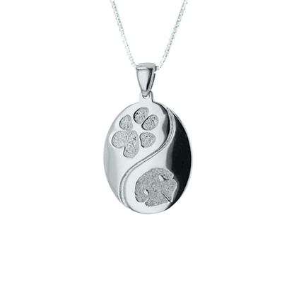 GIF of silver pendant with engraved designs. 
