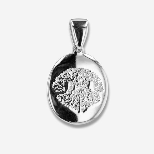Silver pendant with a nose print design on a white background