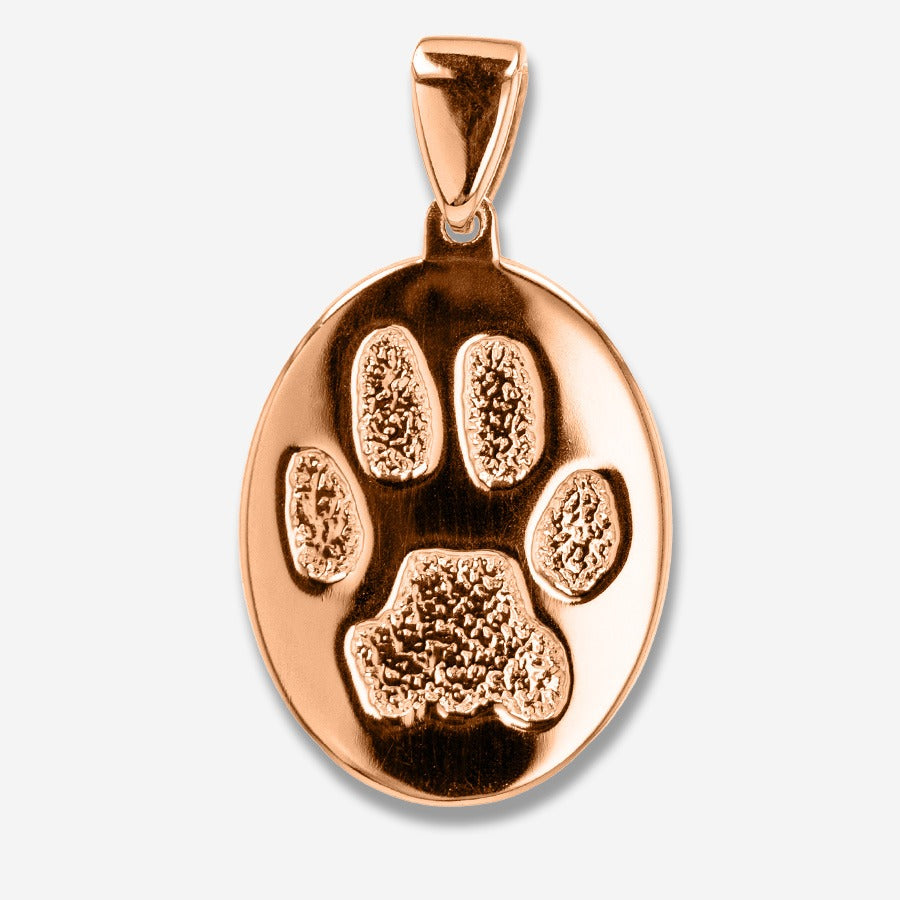 Rose gold paw print pendant on a light gray background